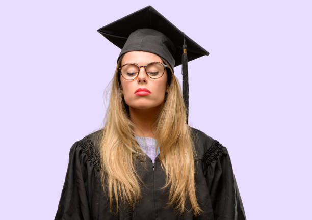istock Young woman university graduate student with sleepy expression, being overworked and tired 1042425390