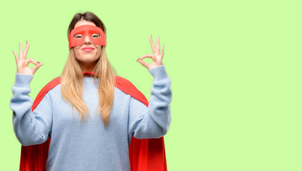 istock Young super woman doing ok sign gesture with both hands expressing meditation and relaxation 1042425480