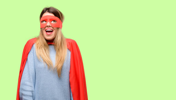 istock Young super woman thinking and looking up expressing doubt and wonder 1042425490