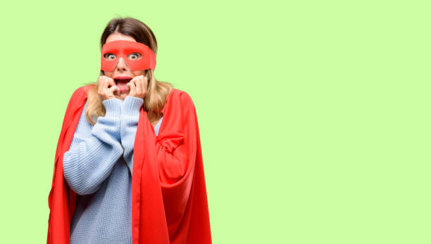 istock Young super woman terrified and nervous expressing anxiety and panic gesture, overwhelmed 1042425496