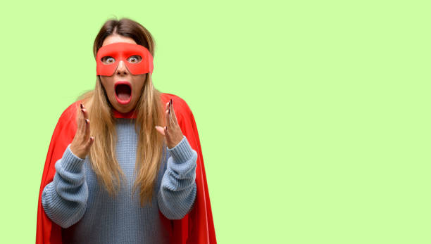 istock Young super woman stressful keeping hands on head, terrified in panic, shouting 1042425536