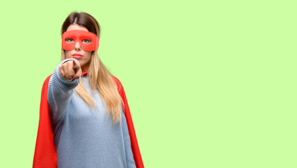 istock Young super woman pointing to the front with finger 1042425558