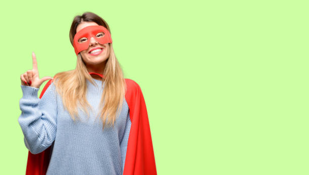 istock Young super woman pointing away side with finger 1042425568