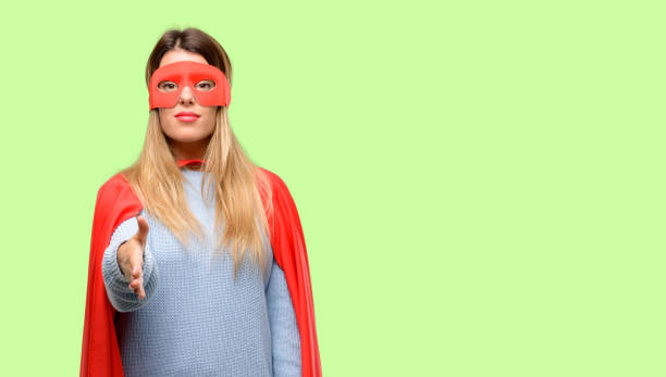 istock Young super woman holds hands welcoming in handshake pose, expressing trust and success concept, greeting 1042425594