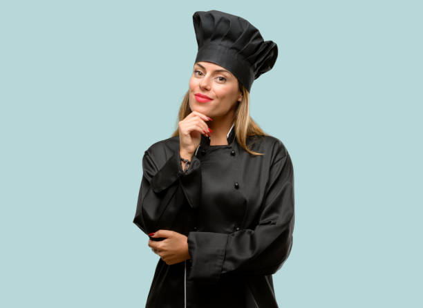 istock Young cook woman thinking and looking up expressing doubt and wonder 1042425640