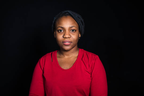 istock Young african woman on black background 1042425672