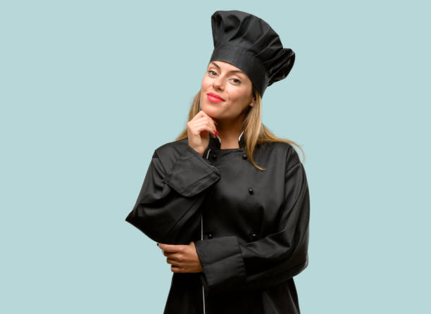 istock Young cook woman thinking and looking up expressing doubt and wonder 1042425770
