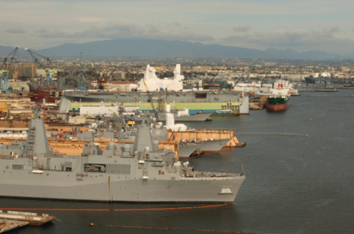 Aerial view of naval ship travelling in San Diego Bay, San Diego, California, USA.