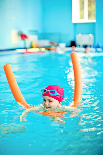 istock Child in a swimming pool 104242925