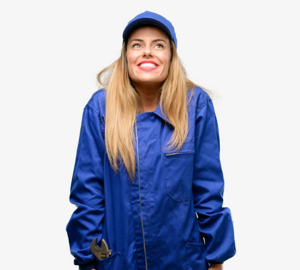 istock Young plumber woman thinking and looking up expressing doubt and wonder 1042429556