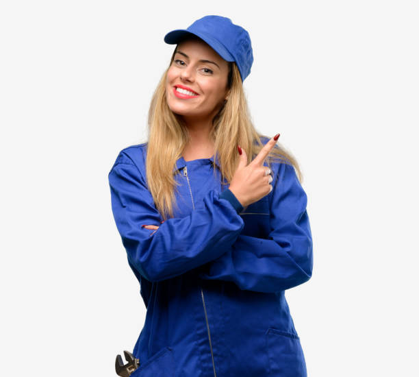 istock Young plumber woman pointing away side with finger 1042429680