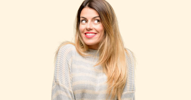 istock Young beautiful woman thinking and looking up expressing doubt and wonder 1042429976