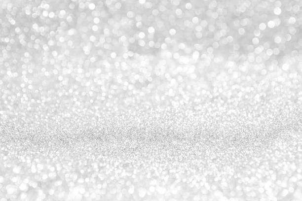 istock abstract background white Silver lights on christmas bokeh 1042430218
