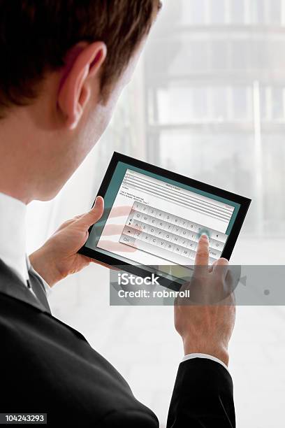 Geschäftsmann Holding Ein Touchpadpcs Schreiben Sie Eine Email Stockfoto und mehr Bilder von Alphabet