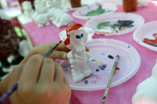 istock Person painting plaster figure 1042433268