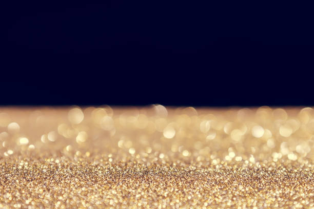 istock abstract background gold light bokeh christmas holiday 1042433552