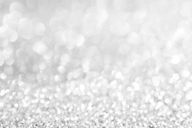 istock abstract background white Silver lights on christmas bokeh 1042433984