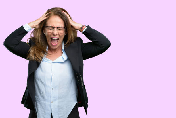 istock stressful keeping hands on head, terrified in panic, shouting 1042434312