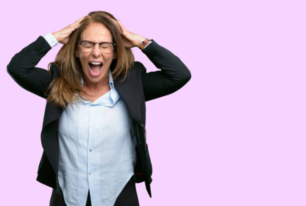 istock stressful keeping hands on head, terrified in panic, shouting 1042434314