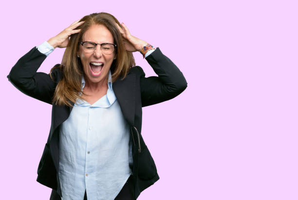 istock stressful keeping hands on head, terrified in panic, shouting 1042434316