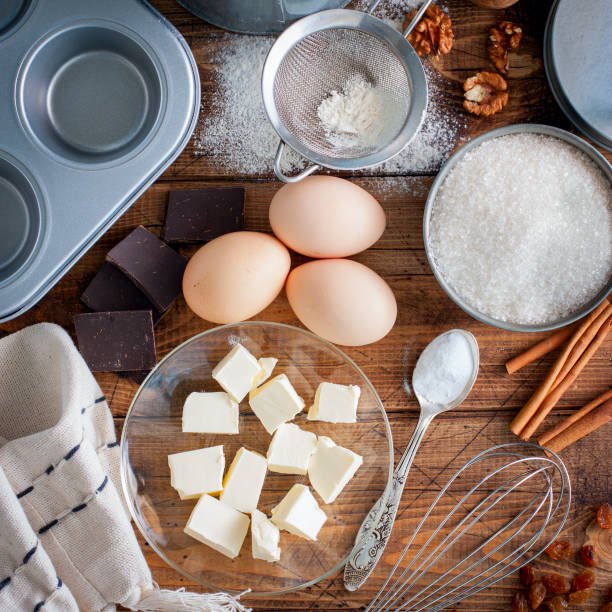 istock Baking background. Cooking ingredients for dough and wooden board on white rustic wood. Top view with copy space, recipe or culinary classes. 1042437688