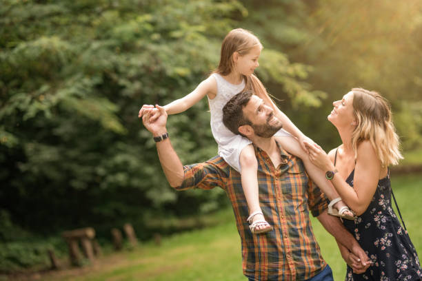 istock Young family having fun outdoors. 1042440238