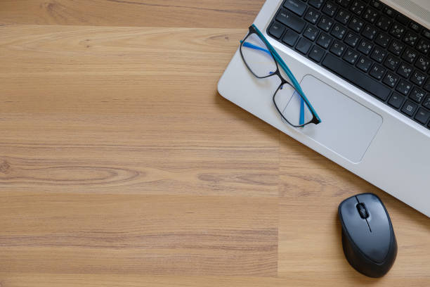 istock Laptop on wood. 1042440720