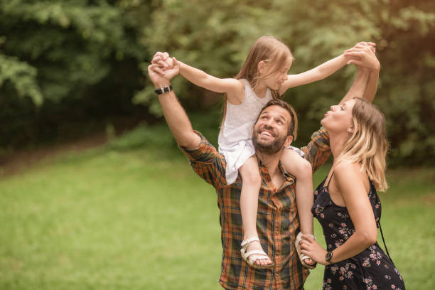 istock Young family having fun outdoors. 1042440832