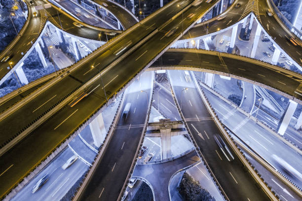 istock aerial view of highway interchange at night 1042446932