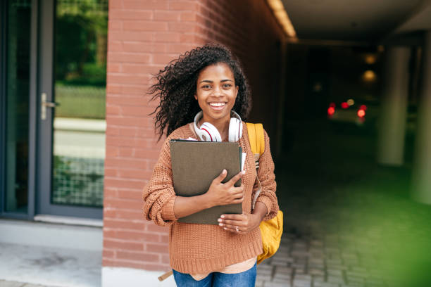 istock International student with backpack, headphones and digital gadgets 1042447176