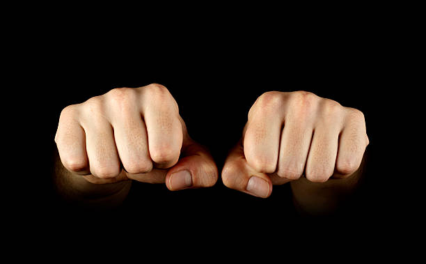 istock Two fists isolated on black background 104244852