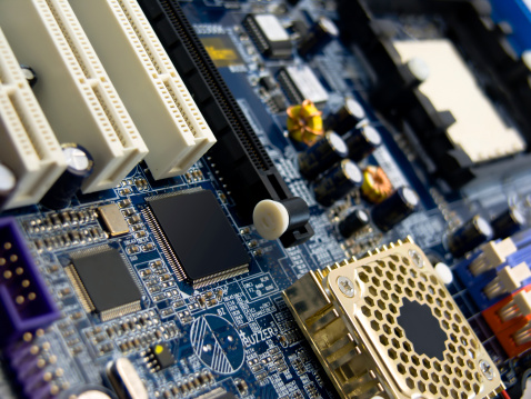 Close-up photo of view of blue system board (computer part)