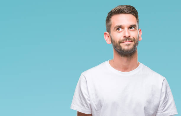 istock Young handsome man over isolated background smiling looking side and staring away thinking. 1042450826