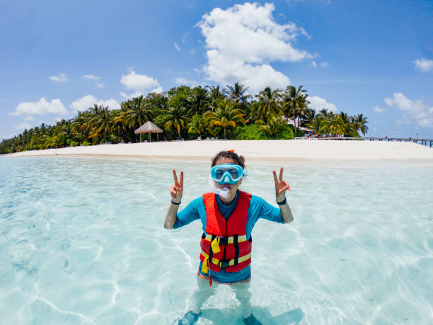 istock Swimmer is ready for snorkeling at Maldives 1042451066