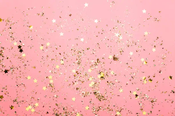 Pink festive confetti background. Bright background for celebration birthday. top view, flat lay.
