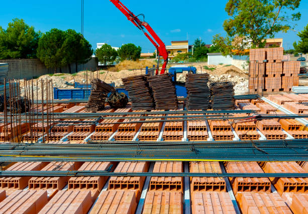 istock Crane settled steel bars construction materials, in a construction site. 1042466118