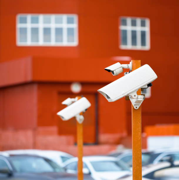 istock Surveillance cameras in the Parking lot. 1042471734
