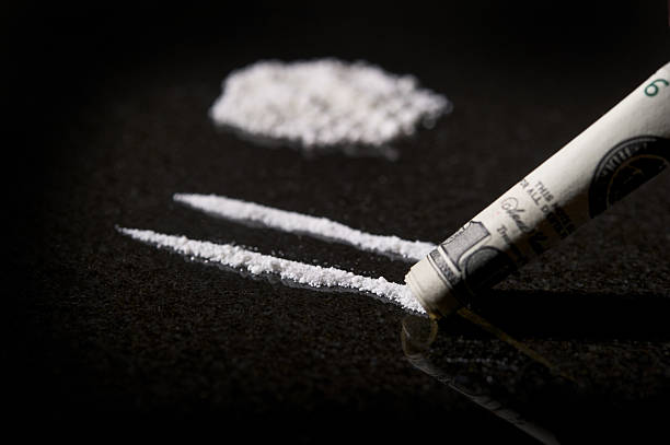 Lines of Cocaine with rolled bill stock photo