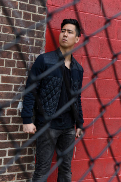 istock young man, outdoors, casual fashion 1042492494