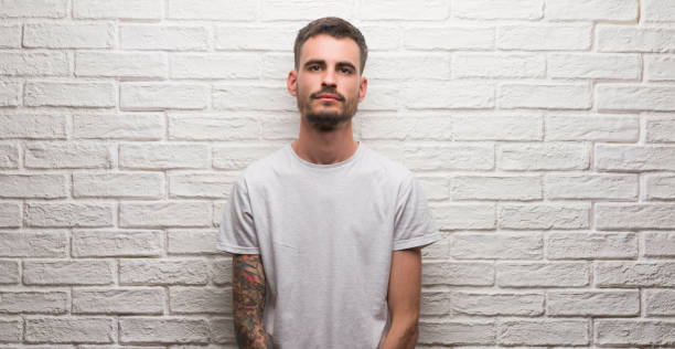 Free Stock Photo of Man Standing in Front of White Brick Wall ...