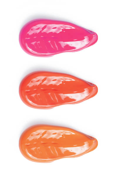 istock Smudged lipsticks and lipgloss isolated on white background 1042498198