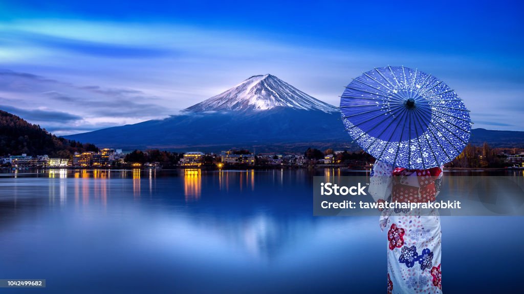 Asian woman wearing japanese traditional kimono at Fuji mountain, Kawaguchiko lake in Japan. Japan Stock Photo