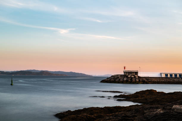 istock Cliffs and small lighthouse in Pontevedra, Spain 1042508766