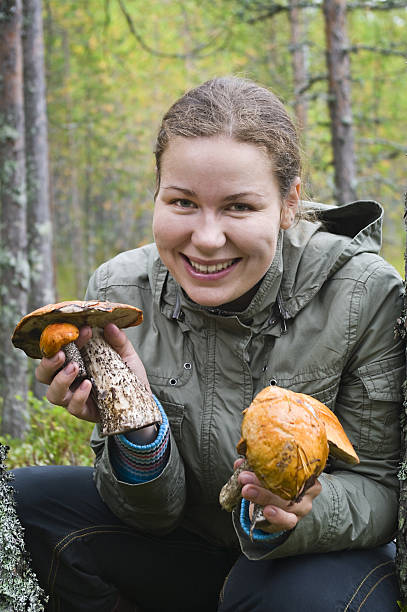 istock Young woman with mushrooms 104252232