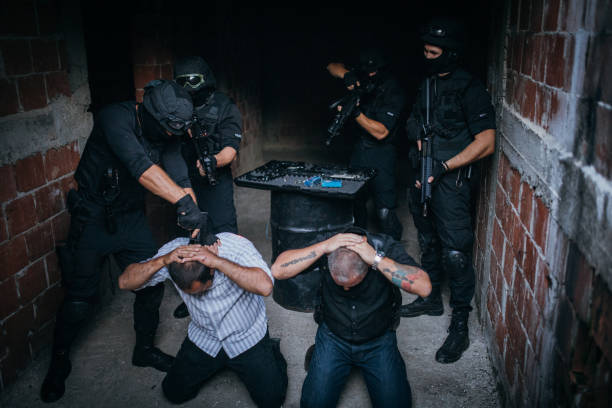 SWAT team arresting gangsters
