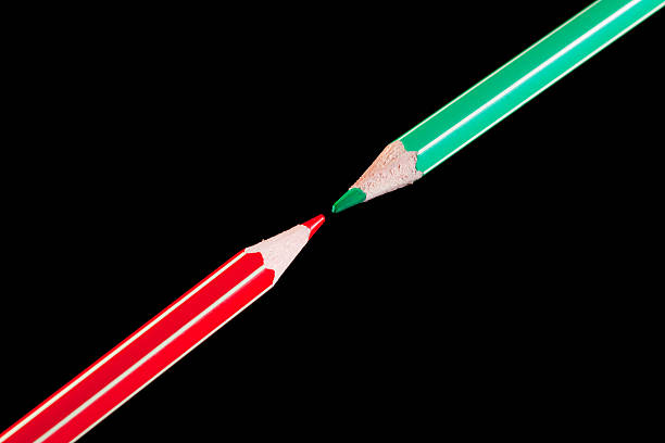 Red and green pencils closeup stock photo
