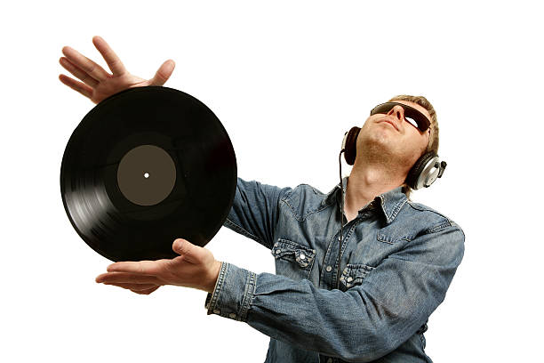 istock dj in headphones twists a plate 104253590
