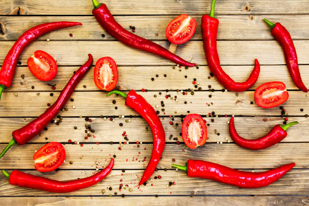 istock Red chili peper on wooden background Close up 1042538250