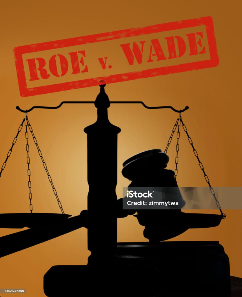 Roe v Wade concept Court gavel and scales of justice silhouette with Roe v Wade stamp ( abortion rights concept ) Abortion Stock Photo