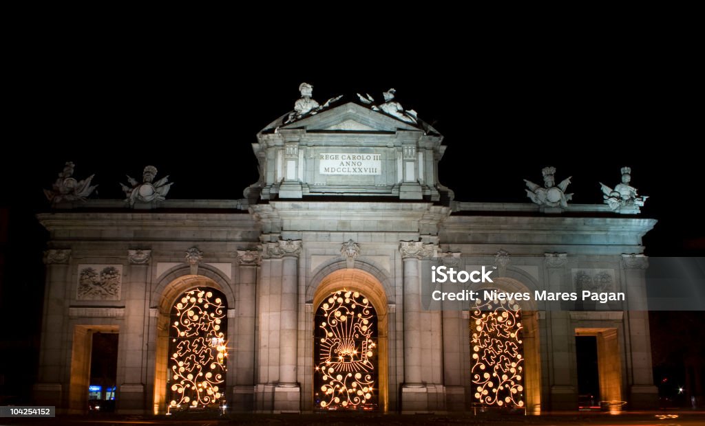 The Puerta de Alcalá  in Christmas (Madrid) The Puerta de Alcalá ("Alcalá Gate") is a monument in the Plaza de la Independencia ("Independence Square") in Madrid, Spain. Alcala Gate Stock Photo